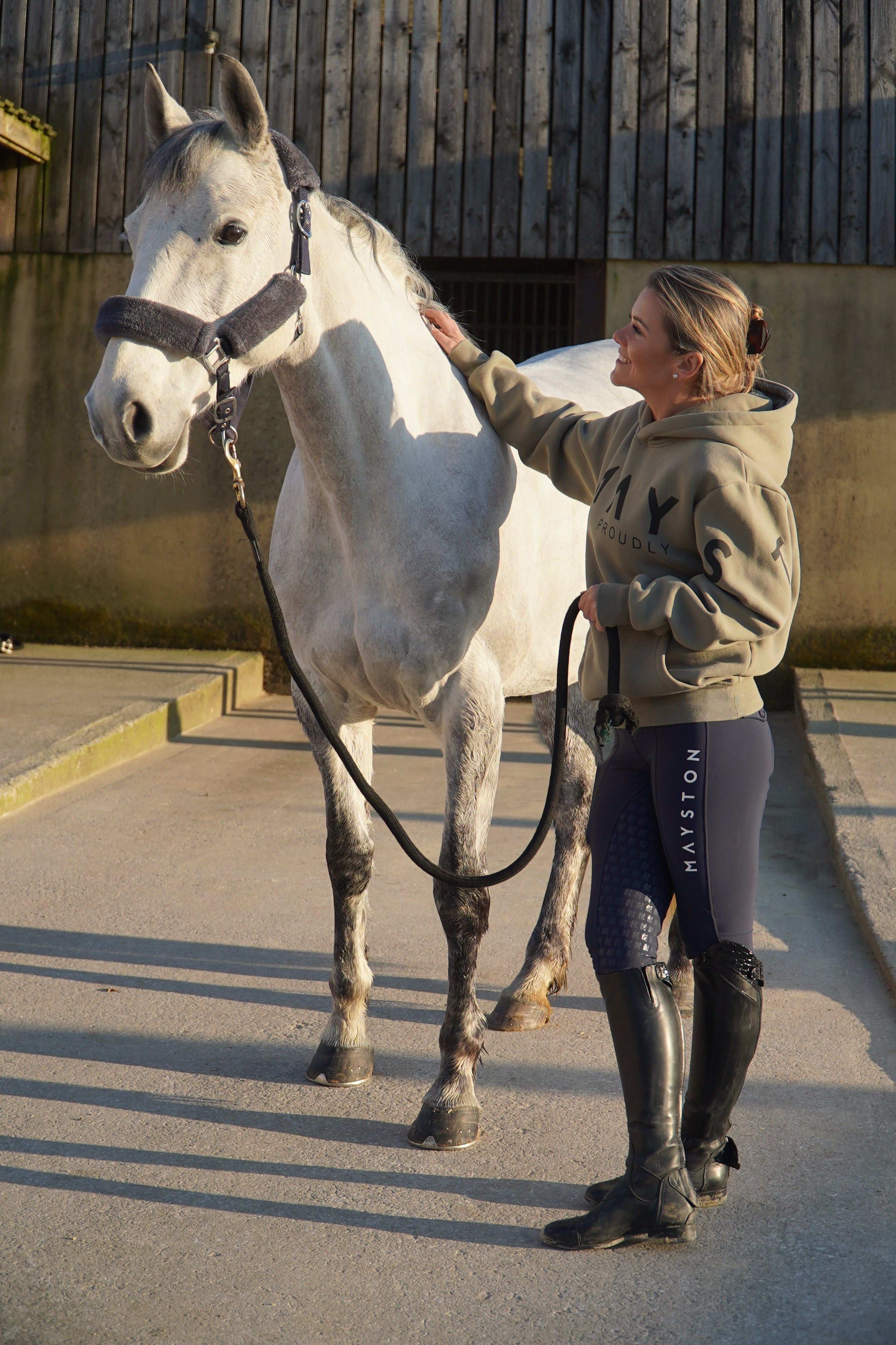 High quality luxurious 100% cotton. wrap around bold logo. soft, cozy and warm. Hoodie, jumper sweatshirt. everyday wear. casual and smart. Gtreen Hoodie, woman standing with horse